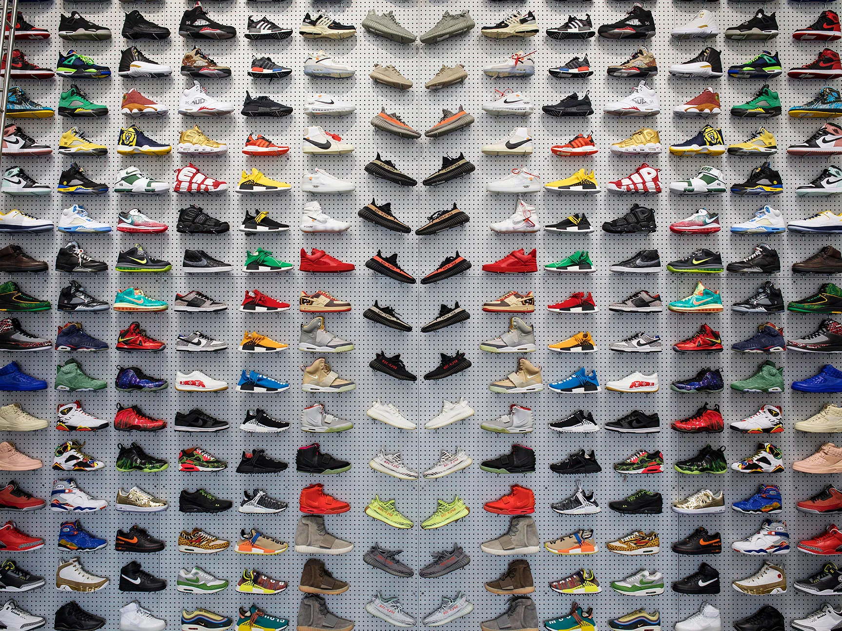 An image of shoes on the shelf in the flight club ready for sale.